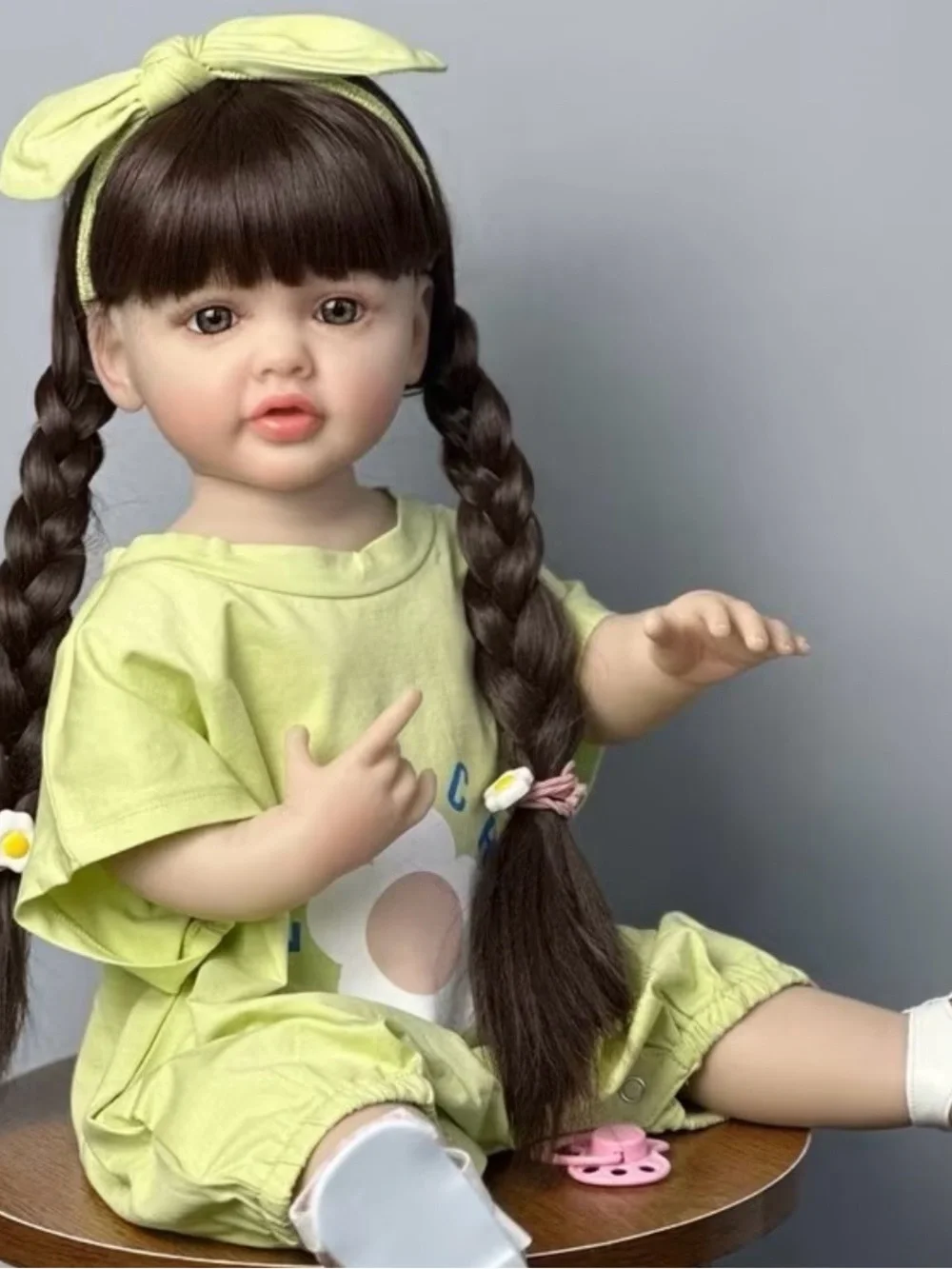 Plush Realistic Baby Doll in Light Green Outfit with Headband